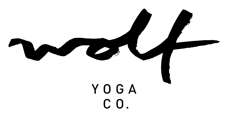 The Wolf Yoga Co. wordmark — brush-script wolf above YOGA CO. in spaced capitals